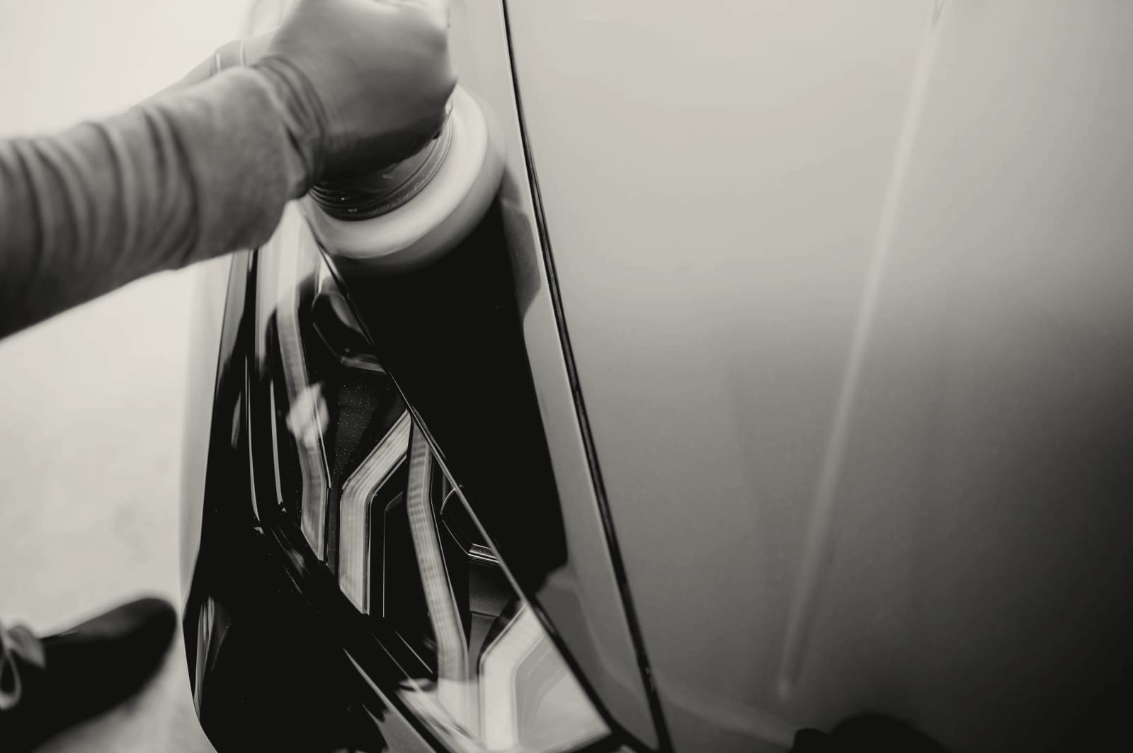 Machine polishing a painted panel during an exterior detail